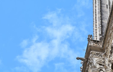 Fototapeta na wymiar Gargoyle on Notre Dame de Paris on background of skyline of Paris, France.