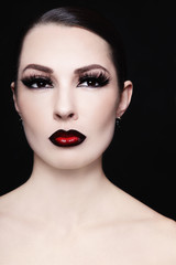 Portrait of young beautiful woman with gothic ombre lips