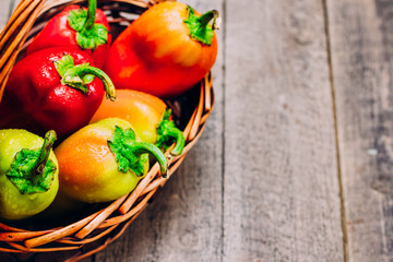 Colorful Sweet Green Yellow Red Bell Peppers on Wooden Table Background. Rainbow Vegetable. Vegetarian Healthy food. Autumn Harvest. Top view, Copy Space