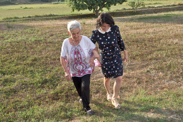 two women walking a field,