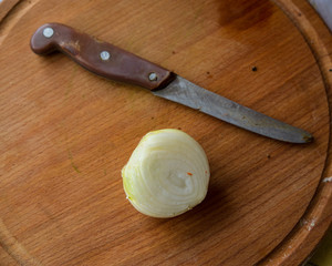 old kitchen knife and a cut onion