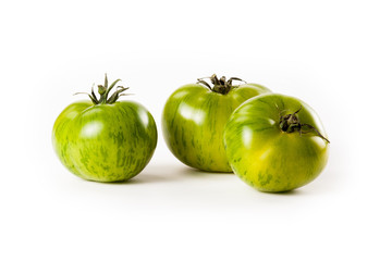 green tomatoes on white background