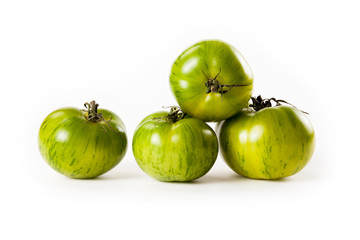 green tomatoes on white background