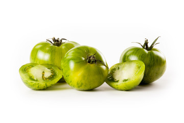 green tomatoes on white background