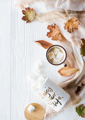 Fall still life with yellow leaves, coffe with marshmallows and 