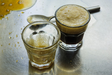 Two shot glasses of espresso coffee