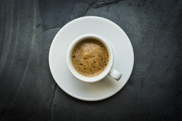 White espresso Coffee cup on a slate background 15.09.2017