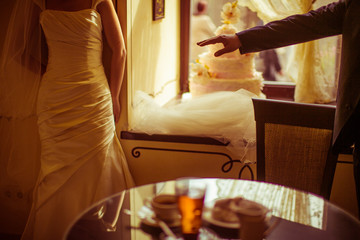 Groom reaches his hand out to the bride