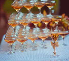 Pyramid of cocktail glasses stands on the table