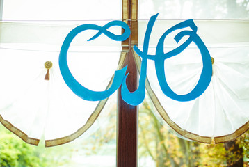Newlyweds initials hang on the window