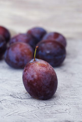 Plum fruits fresh rustic on wood background