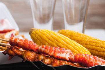 corn cobs and shish kebab