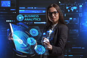 The concept of business, technology, the Internet and the network. A young entrepreneur working on a virtual screen of the future and sees the inscription: Business analytics
