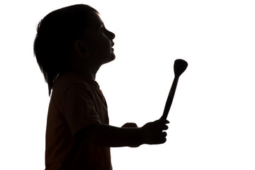 silhouette of little boy with tassel for drawing looking up