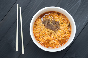 A bowl with noodles with meat
