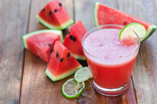 slice of watermelon for smoothies with lime on woods background
