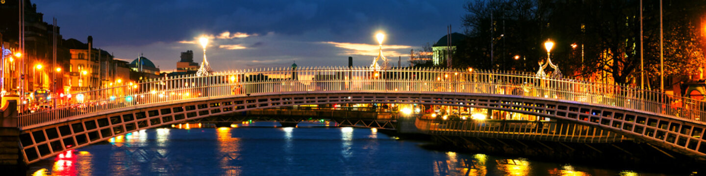 Dublin, Ireland. Night View Of Famous Ha Penny Bridge