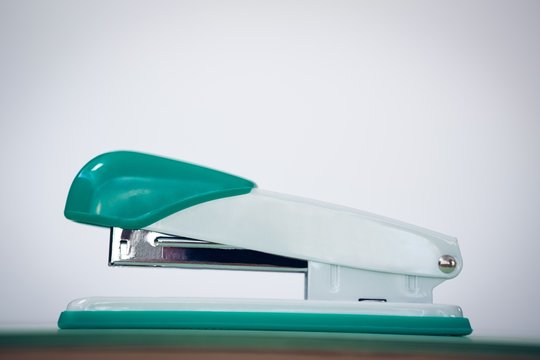 Close up of stapler against wall