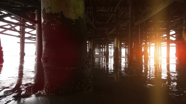 High quality video of walking under pier in 4K 