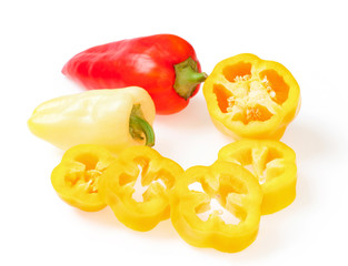 Ripe red, yellow bulgarian pepper, with slices of fresh pepper. On white