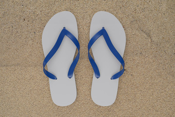 Fototapeta na wymiar 3d rendering slippers isolated on sand background mock-up