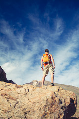Fototapeta premium Man celebrating inspiring mountains view