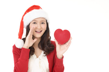 サンタ帽を被った笑顔の女性