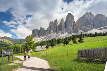 Hikers along a stunning trail in the Dolomites, Northern Italy, Europe
