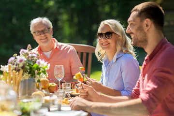 happy family having dinner or summer garden party