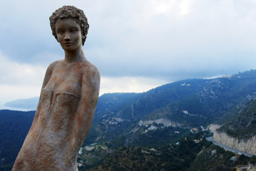 Statue portrait high up with mountain view