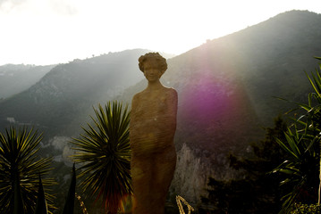 Statue portrait high up with mountain view