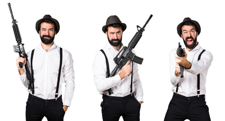 Hipster man with beard holding a rifle