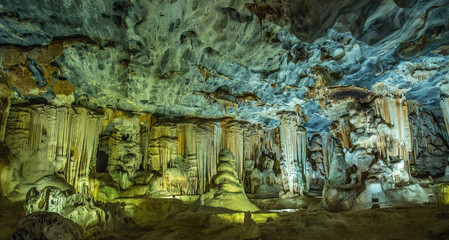 Fototapeta na wymiar old cave illuminated and showing stalactites and stalagmites