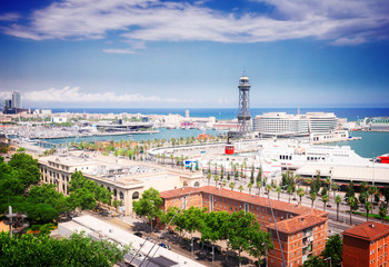 Cityscape of Barcelona with port Vell, , toned