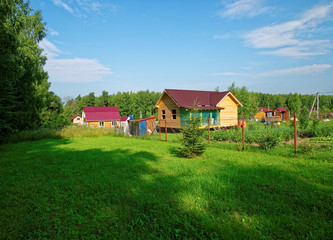 Fototapeta na wymiar wooden house for a rural plot in the spring