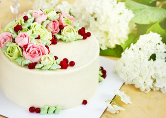 Birthday cake with flowers rose on light background