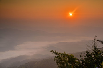 Naklejka premium Mountain covered with fog in morning