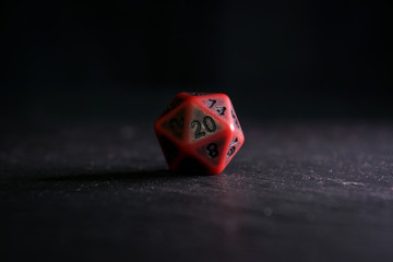 A polyhedral twenty sided die used for role playing games such as Dungeons & Dragons.