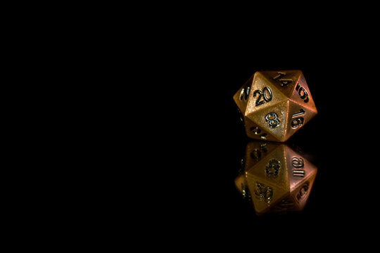 A polyhedral twenty sided die used for role playing games such as Dungeons & Dragons.