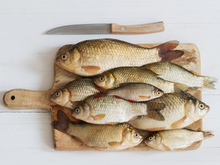 river raw fish on wooden table
