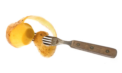 a pottatoe on a fork isolated on white