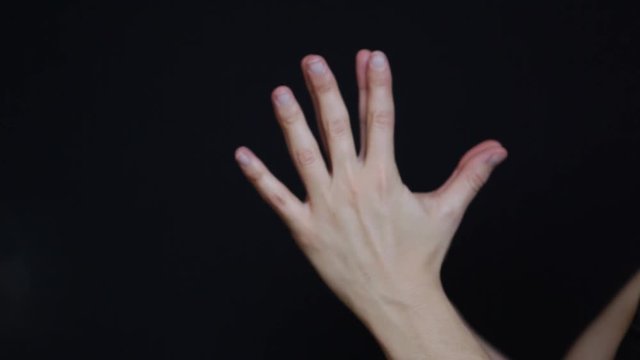 Woman's hands practicing yoga
