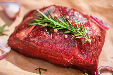Raw fresh beef on white stone background, top view