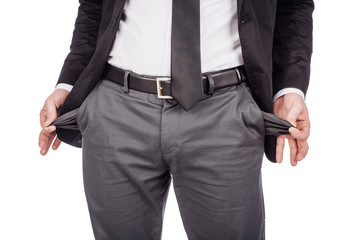 businessman showing his empty pockets isolated on white background