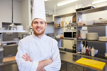 happy male chef cook at restaurant kitchen