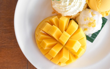 Mango sticky rice served with mango sherbet ice cream, summer dessert.