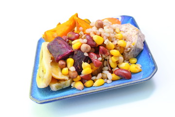 Close up of mix boiled cereals healthy food in blue plate.