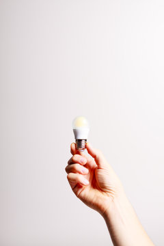 Led light bulb in male hand.