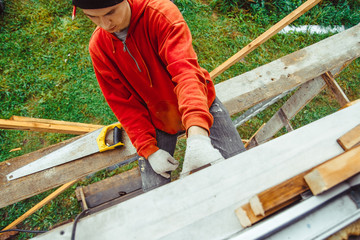 a worker on the facade of the building