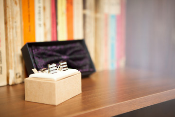 Shirt buttons and bow in a box. Wedding day and ceremony
